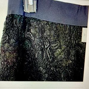 Anne Klein black skirt with lace overlay.  Short length, scalloped hem. Size 10.